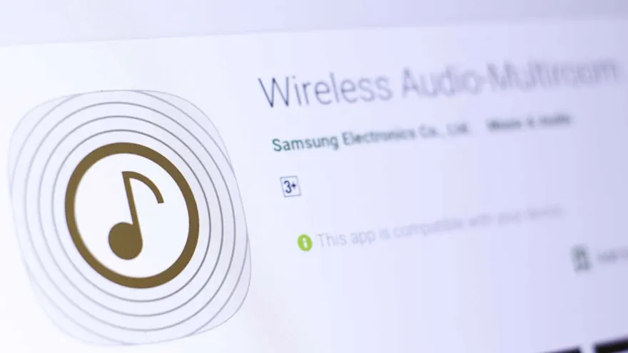 Een schermafbeelding van de app "Wireless Audio Multiroom" met een gouden muzieknoot binnen concentrische cirkels.