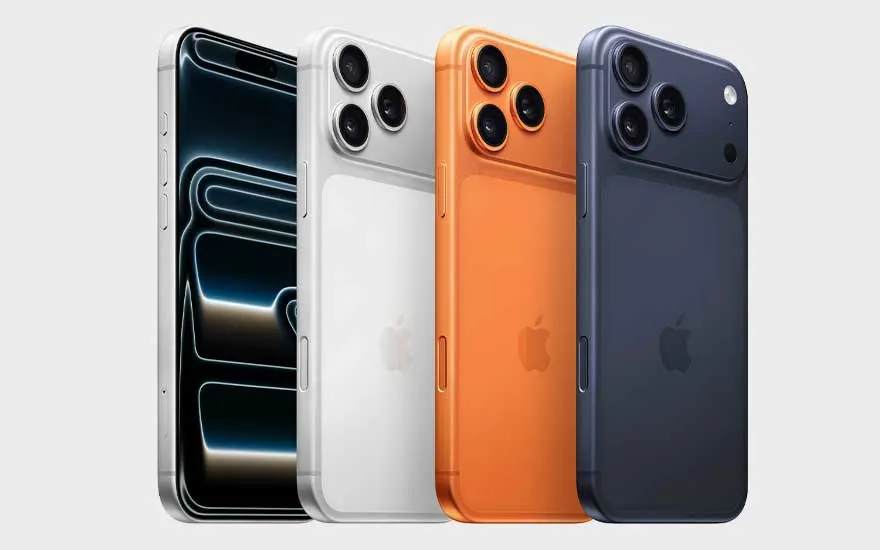 Vier smartphones staan naast elkaar in zilver, wit, oranje en donkerblauw; één toestel toont een scherm met een donkere, gloeiende vorm.