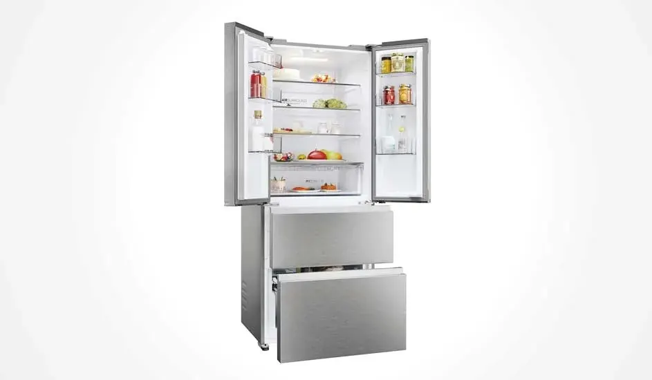 Silver refrigerator with double doors at the top and two drawers at the bottom. Filled with fresh food and bottles, practical and stylish design.