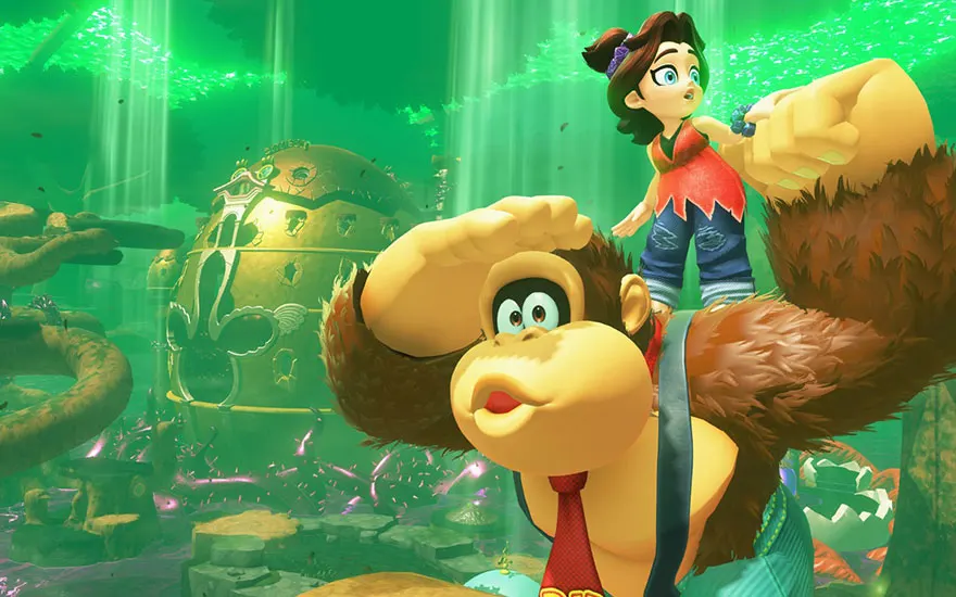 Donkey Kong et Pauline explorent ensemble un monde sous-marin mystérieux avec des rayons de lumière verte et d'anciennes ruines aquatiques.