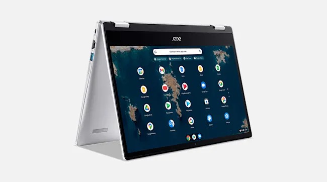 Ordinateur portable argenté en mode tente sur fond blanc. L'écran affiche une carte du monde et des icônes d'applications.