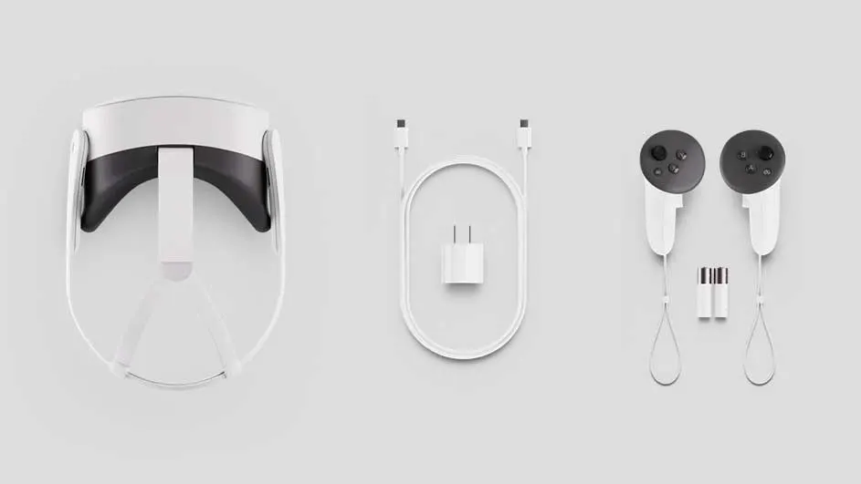Witte VR-headset met controllers, batterijen en oplader op een grijze achtergrond.