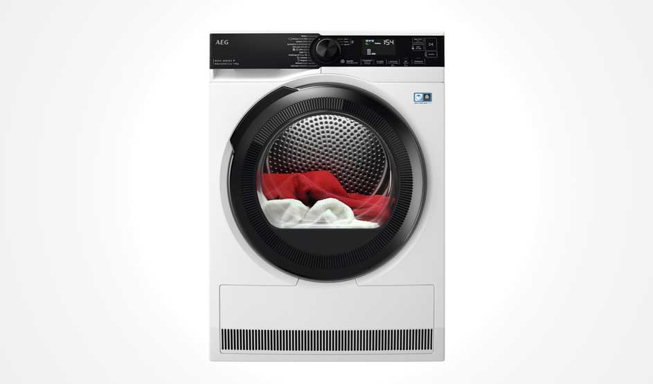 A white AEG tumble dryer with a round door and digital display shows red and white laundry in the drum, with the AEG brand visible in the top left corner.