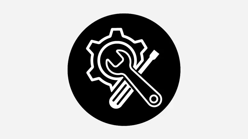 Black circle with white service icon, showing gear wheel with screwdriver and spanner for repair and technical maintenance work.