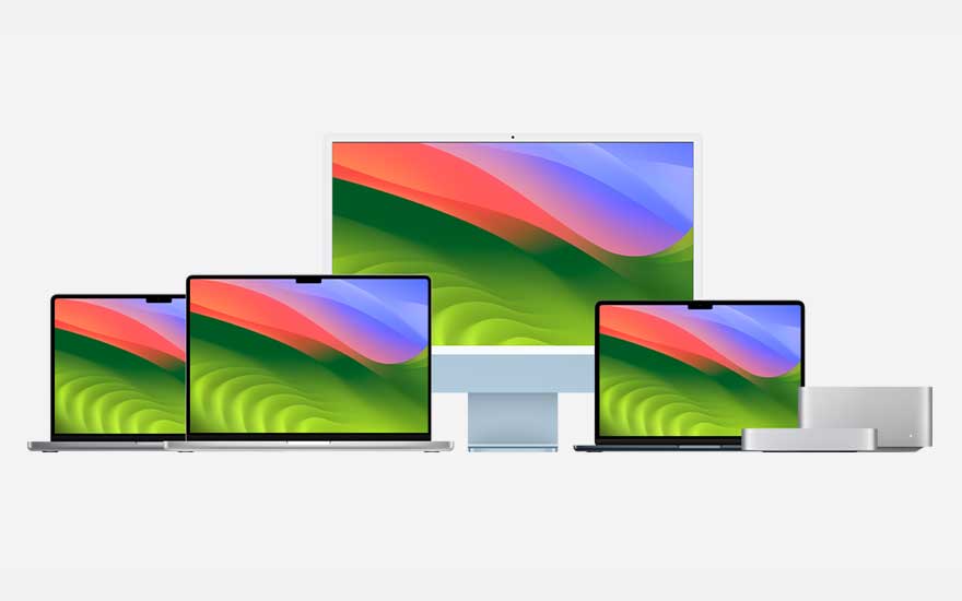 Verschillende laptops en een desktopcomputer staan op een rij tegen een witte achtergrond. De schermen zijn aan.