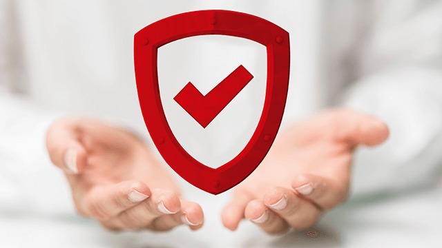 Red shield with a checkmark hovers above two outstretched hands against a blurred white background.