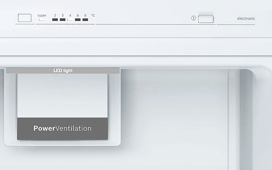 Close-up of a white refrigerator interior with temperature settings at the top and "PowerVentilation" label on a gray panel.