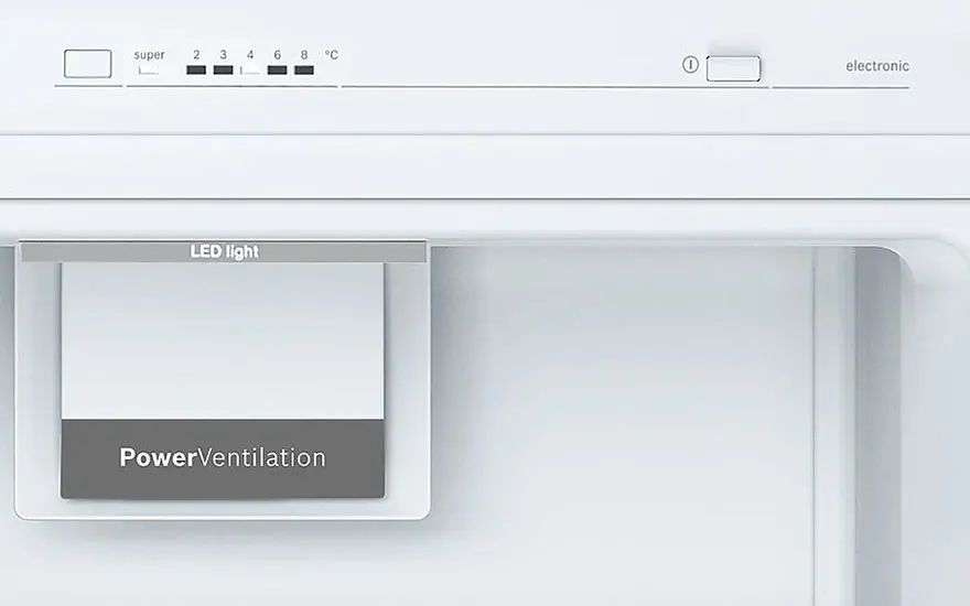 Close-up of a white refrigerator interior with temperature settings at the top and "PowerVentilation" label on a gray panel.