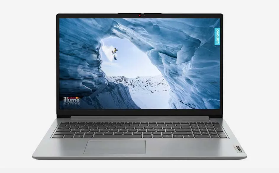 Ordinateur portable gris ouvert, écran affichant un paysage de montagne enneigée. Clavier gris foncé visible.