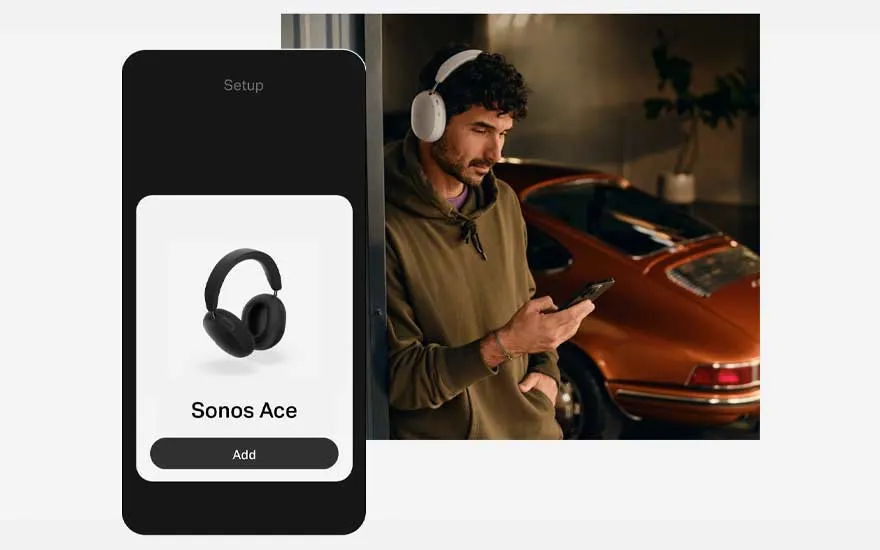 Een zwarte smartphone toont een app voor het instellen van Sonos Ace-hoofdtelefoons, met een oranje auto op de achtergrond.