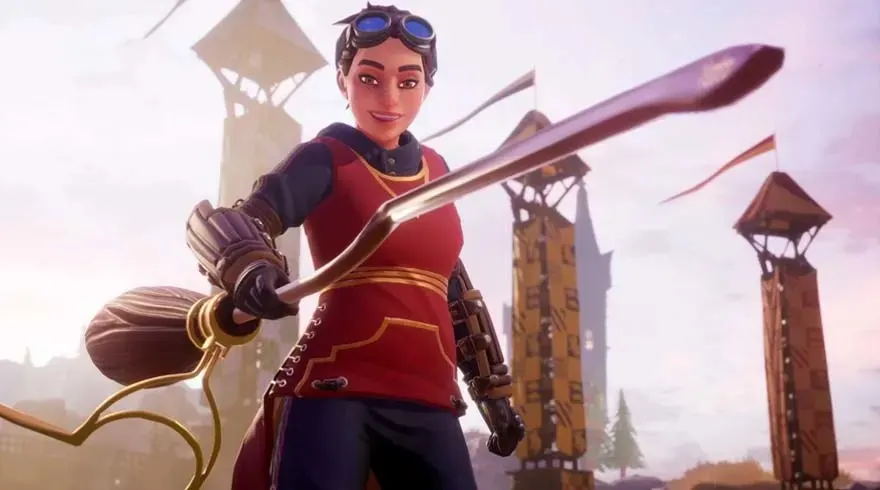 Une arène avec des tours en bois, une personne tenant un manche à balai.