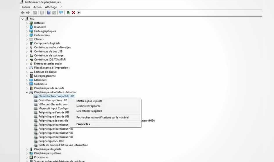 Gestionnaire de périphériques Windows affichant les options du pilote de clavier tactile HID. Menu contextuel "Propriétés" ouvert.