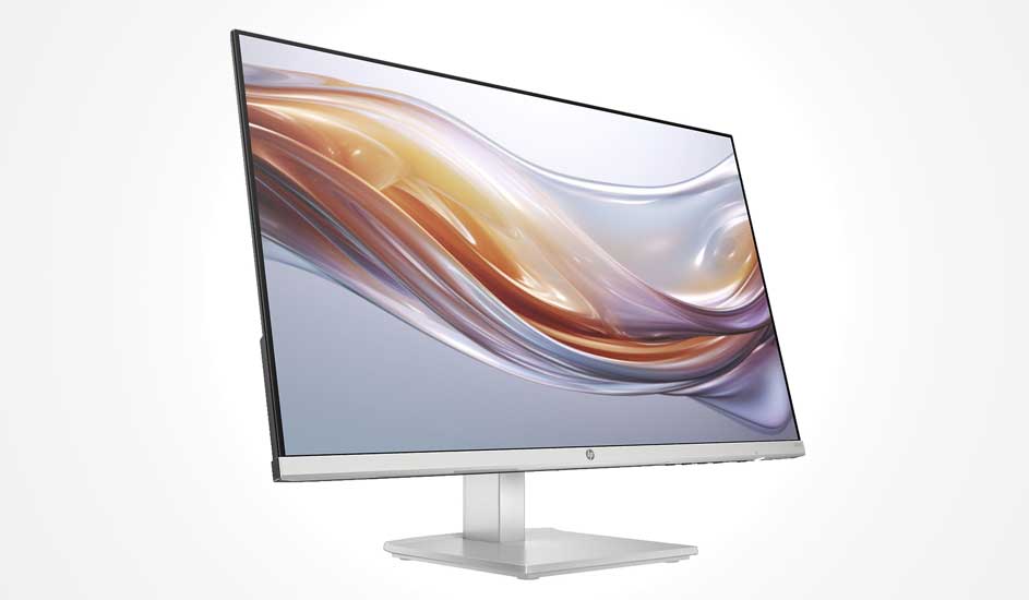Slim HP monitor with near borderless design shows a flowing golden wave on pale background, resting on a sleek stand.