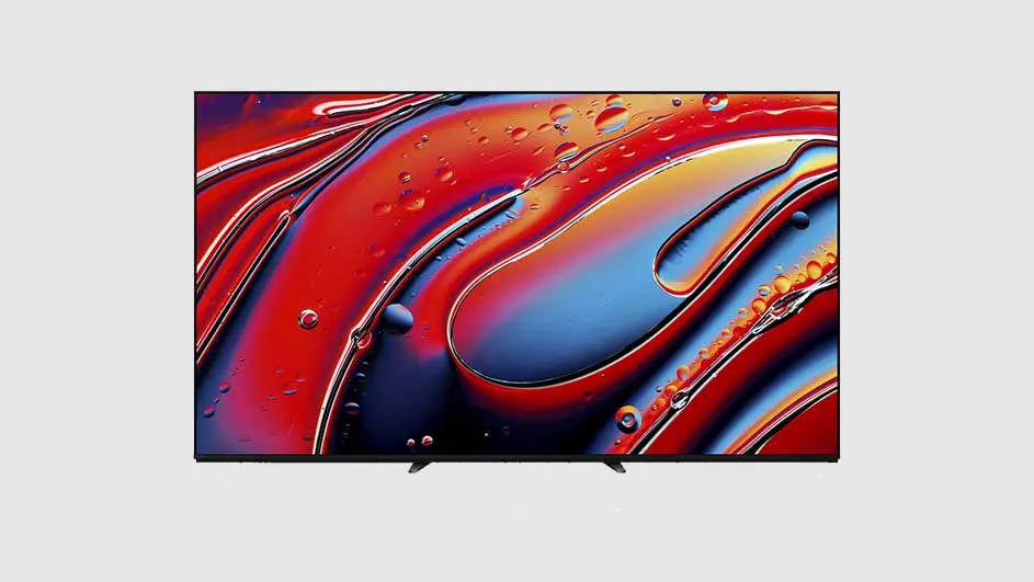 Téléviseur noir affichant un motif abstrait rouge, bleu et jaune avec des gouttes, sur fond gris clair.