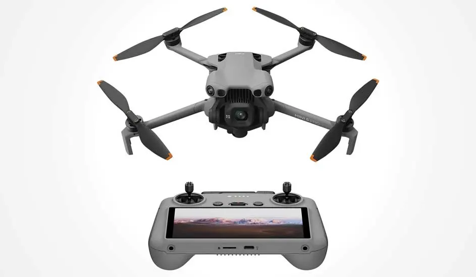 Voici un drone gris DJI Mini 3 Pro à quatre hélices et une télécommande avec écran intégré.