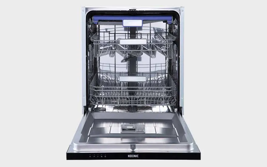 An open dishwasher with metal racks and spray arms, sparkling clean inside and ready to be loaded with dishes and cutlery.