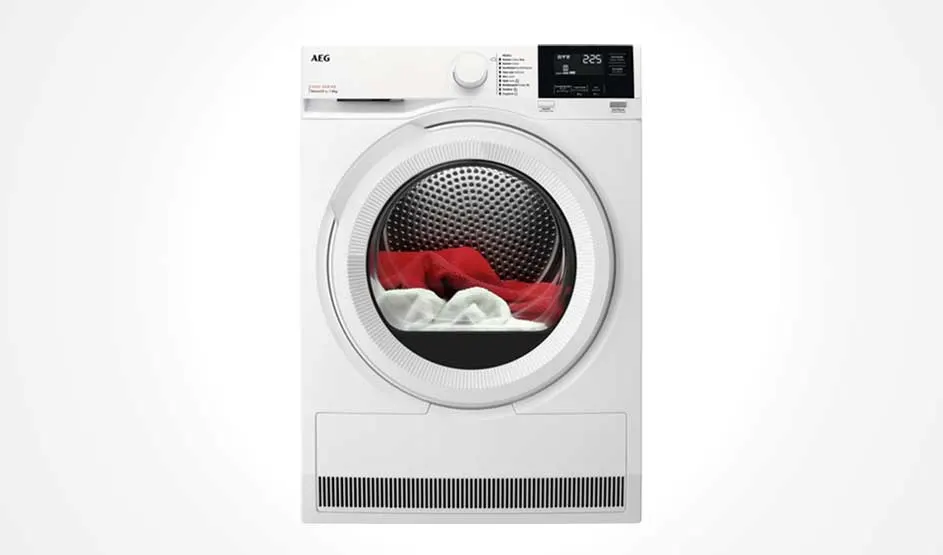 A white AEG tumble dryer with a round door and digital display shows red and white laundry in the drum, with the AEG brand visible in the top left corner.