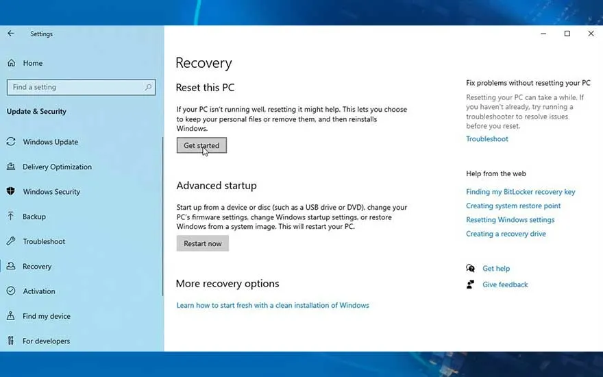 Windows 'Herstel' scherm: 'Deze pc opnieuw instellen' en 'Geavanceerde opstartopties' op lichtblauwe achtergrond.
