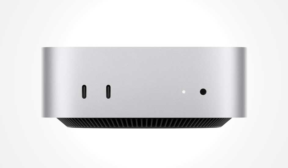 Een compacte, zilverkleurige desktopcomputer met twee USB-C-poorten, een kleine LED en een audiopoort aan de voorkant.