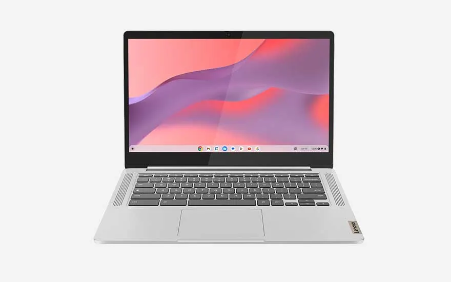 Light grey Lenovo laptop with compact keyboard, screen showing a soft pink and purple background from the ChromeOS style interface.