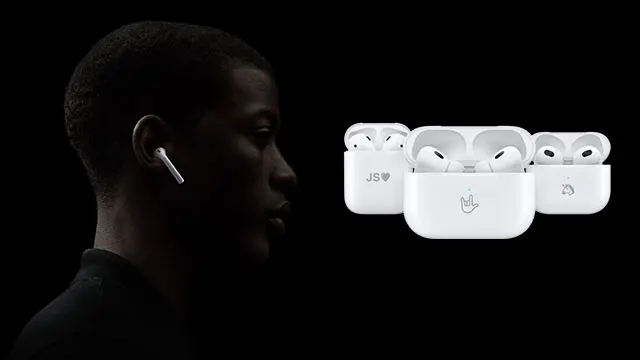 Een zwarte achtergrond met een silhouet van een gezicht en drie witte oplaaddozen met oortjes erin.