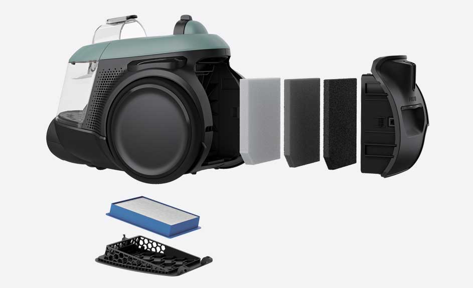 Aspirateur noir et vert avec filtre amovible et base en plastique noir sur fond blanc.