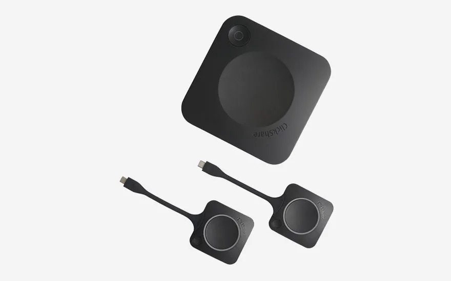 A ClickShare base unit and two USB-C buttons, designed for quickly and easily sharing content during meetings.