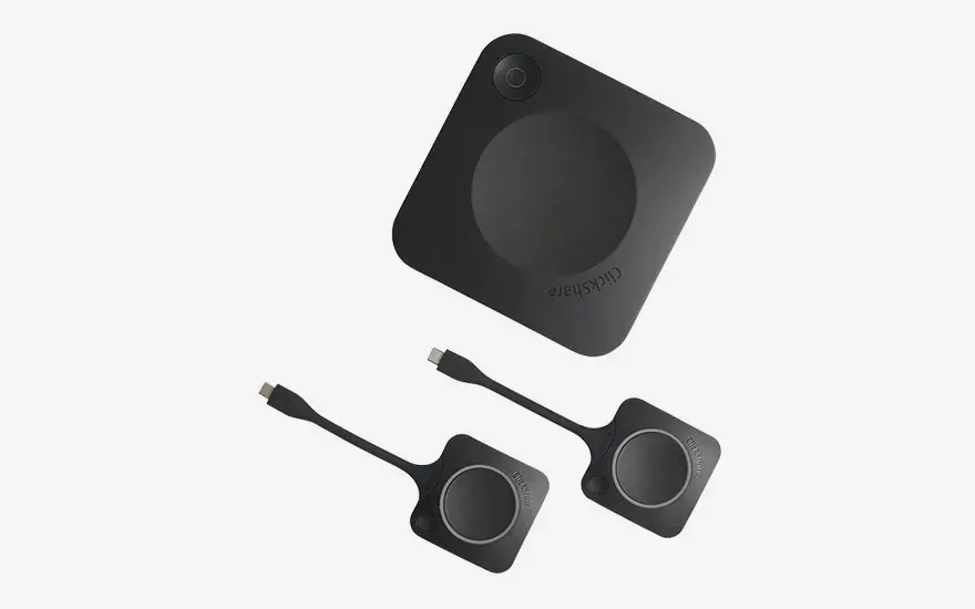 A ClickShare base unit and two USB-C buttons, designed for quickly and easily sharing content during meetings.