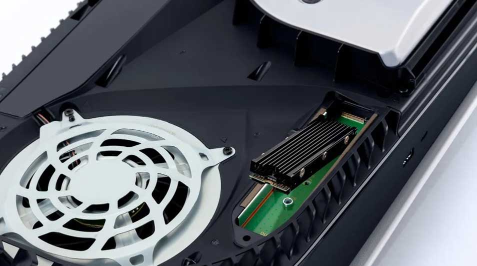 An open PlayStation 5 with a fan and an SSD expansion drive installed, visible in the dedicated slot.
