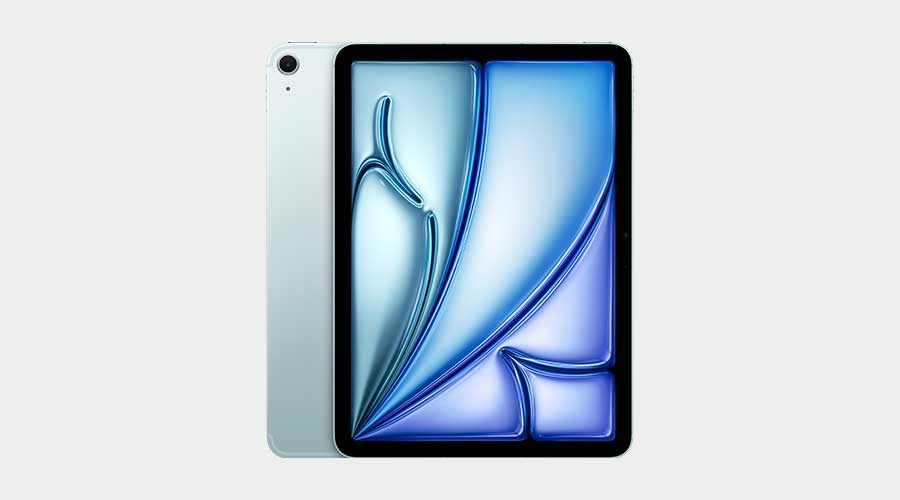 A silver tablet stands upright on a light gray background, showing a bright blue abstract display, with its back partially visible behind.
