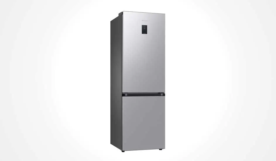 Tall, silver Samsung fridge with two doors, a modern design, a digital display on the upper door, and a freezer at the bottom.