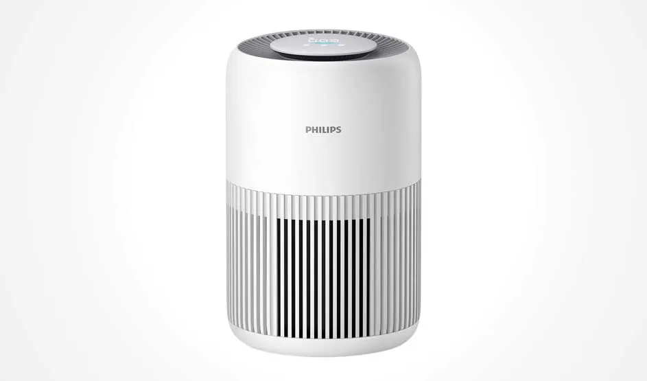 White Philips air purifier with rounded edges and vertical vents stands alone on plain white background, sleek and contemporary.
