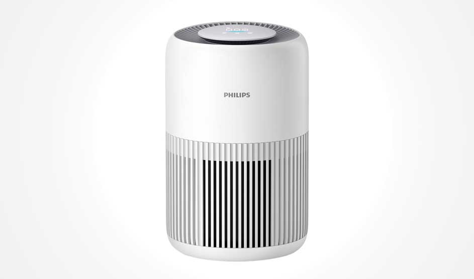 Purificateur d’air Philips blanc, bords arrondis et fentes verticales, posé seul sur fond blanc uni, design sobre et moderne.
