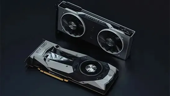 Two powerful graphics cards rest on a dark surface, sleek metal coolers and fans hinting at serious gaming performance.
