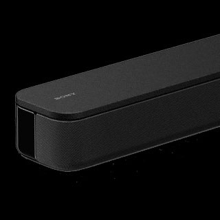 Barre de son noire sur fond noir. La barre a des côtés arrondis et une surface texturée.