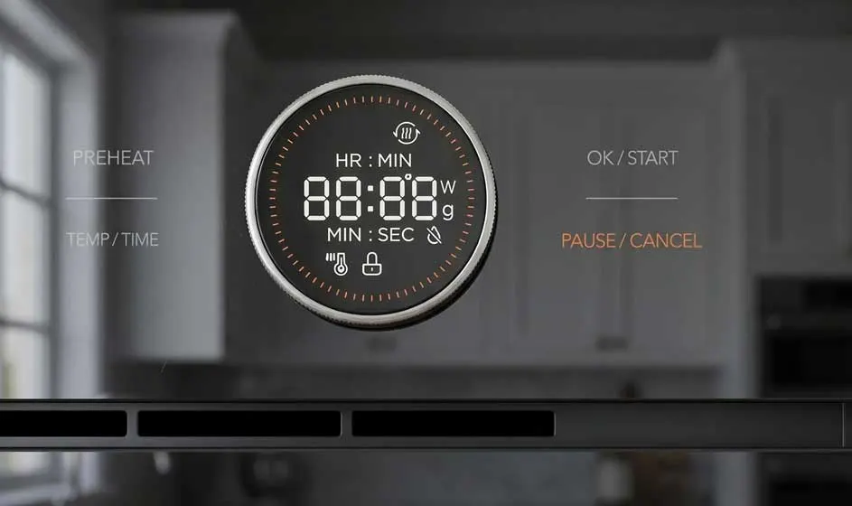 Un minuteur de cuisine rond est placé au centre d’un appareil. Son écran affiche zéro minute et seconde, avec des boutons pour préchauffer et démarrer.