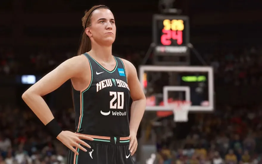 Une joueuse de basket-ball en uniforme noir et vert porte le numéro 20. Un tableau d'affichage rouge est visible en arrière-plan.