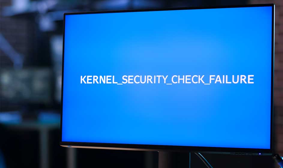 Een computerscherm toont een helderblauwe foutmelding met de tekst ‘KERNEL_SECURITY_CHECK_FAILURE’ tijdens een vermoedelijke systeemcrash.
