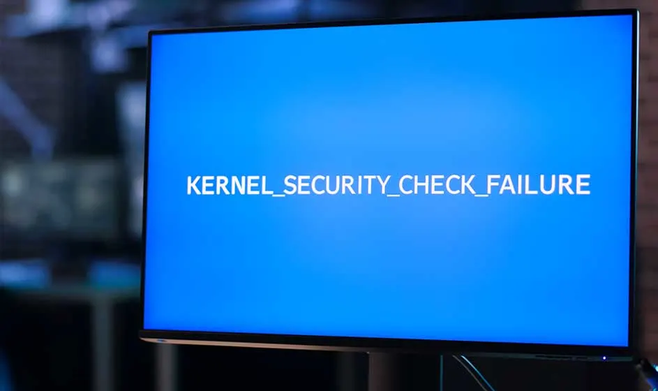 Een computerscherm toont een helderblauwe foutmelding met de tekst ‘KERNEL_SECURITY_CHECK_FAILURE’ tijdens een vermoedelijke systeemcrash.
