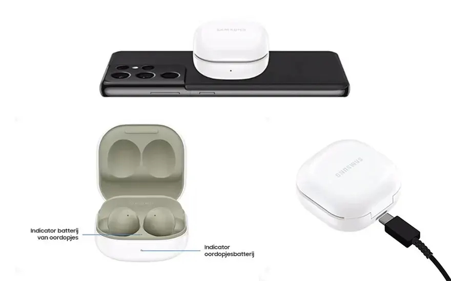 Een zwarte smartphone met witte oordopjes en een oplaadstation op een witte achtergrond.