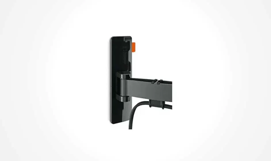 A black TV mount is affixed to a white wall with a cable hanging from it.