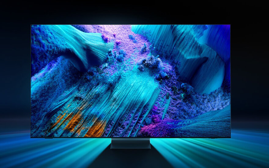 Een tv-scherm toont een abstract blauw en paars landschap. De tv staat op een donkere basis met blauwe lichtstralen.