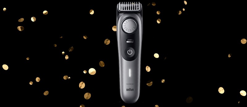 L’image se concentre sur un rasoir Braun argenté, avec des confettis dorés sur fond noir pour un effet festif.