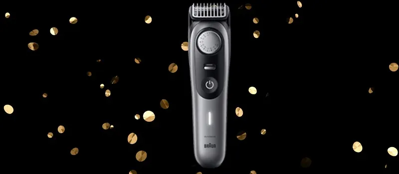 L’image se concentre sur un rasoir Braun argenté, avec des confettis dorés sur fond noir pour un effet festif.