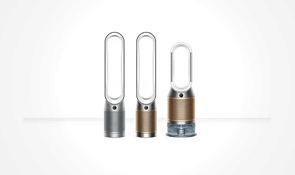 Drie Dyson-luchtreinigers staan op een rij. Ze hebben ovale openingen en grijze of gouden onderdelen.
