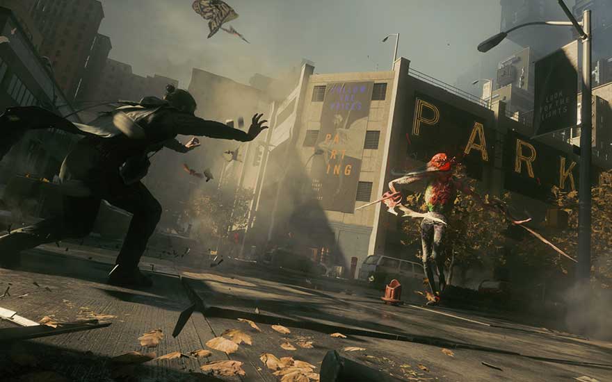 In a ruined city street, a hooded fighter dashes through smoke towards a twisted red creature, debris and autumn leaves swirling wildly.