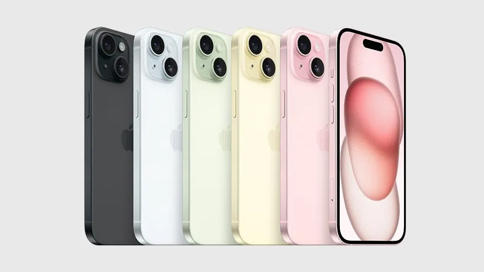 Cinq iPhones alignés : noir, blanc, vert clair, jaune clair et rose. L'écran du téléphone rose est allumé. Fond gris clair.