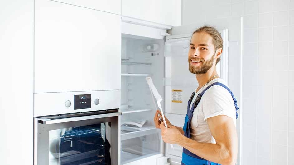 A white kitchen features an open refrigerator, shelves visible. An oven is seen to the left.
