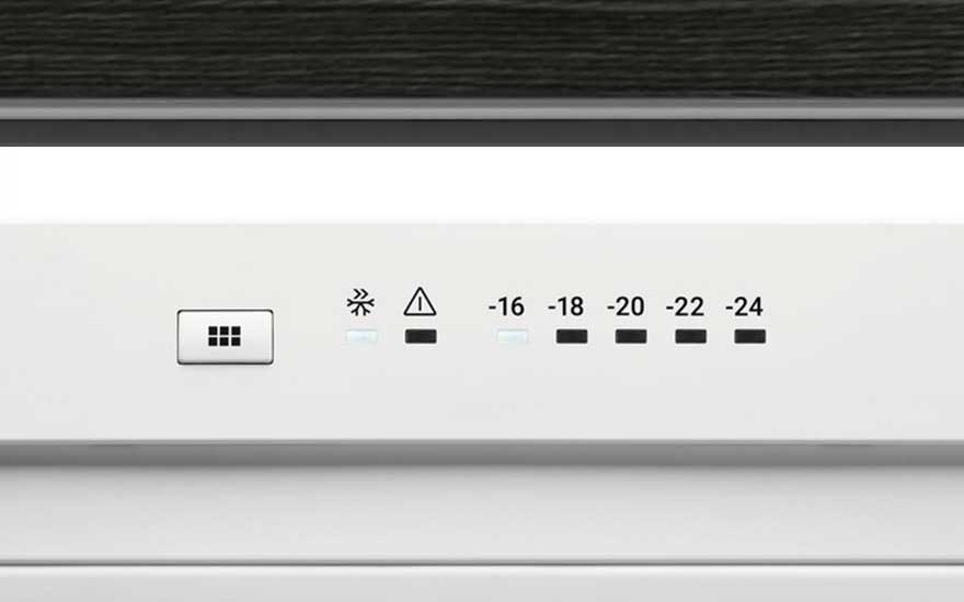 Panneau blanc avec un bouton, un symbole de flocon de neige, un triangle et des températures de -16 à -24 degrés Celsius.