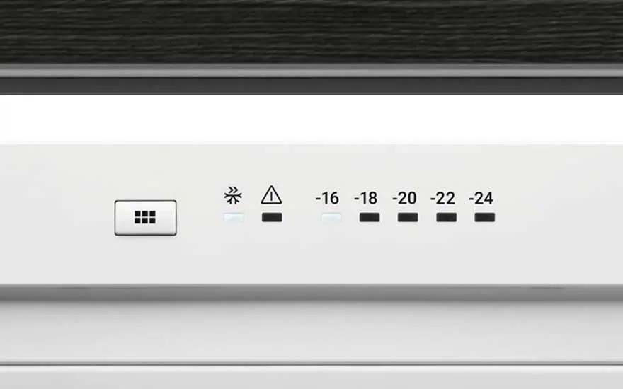 Panneau blanc avec un bouton, un symbole de flocon de neige, un triangle et des températures de -16 à -24 degrés Celsius.